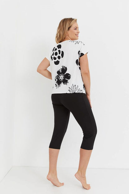 Feminine Pajama Set Perfect For Sleeping  Floral Design Short Sleeved Shirt Made Of Airy Viscose Complete With Matching Smooth Pants Perfect Matched With Shirt